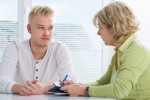 male patient consults with female addiction professional during benzo addiction treatment program