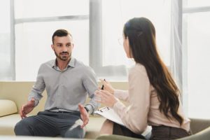 male patient meets with addiction professional during cocaine addiction treatment
