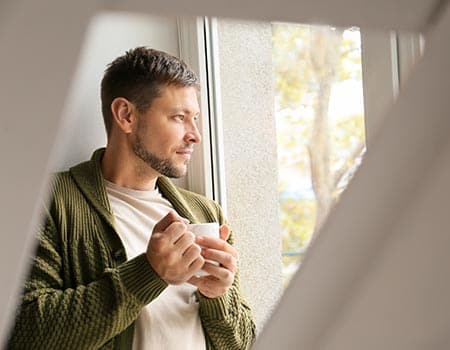 a man drinks tea as he considers true life center